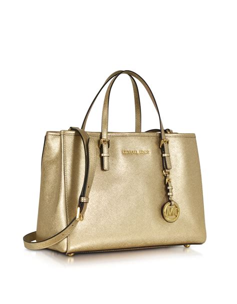 michael kors pale gold clutch|Michael Kors gold tote handbags.